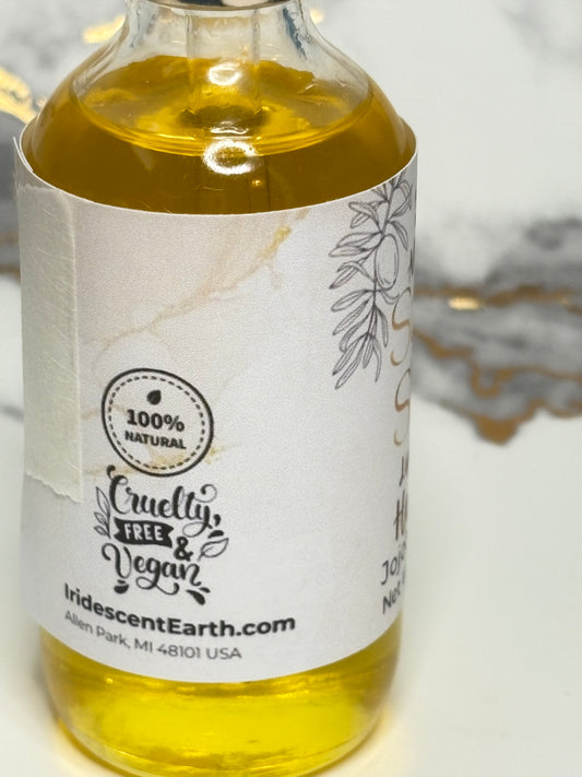 Bottle of oil with a label on a white background