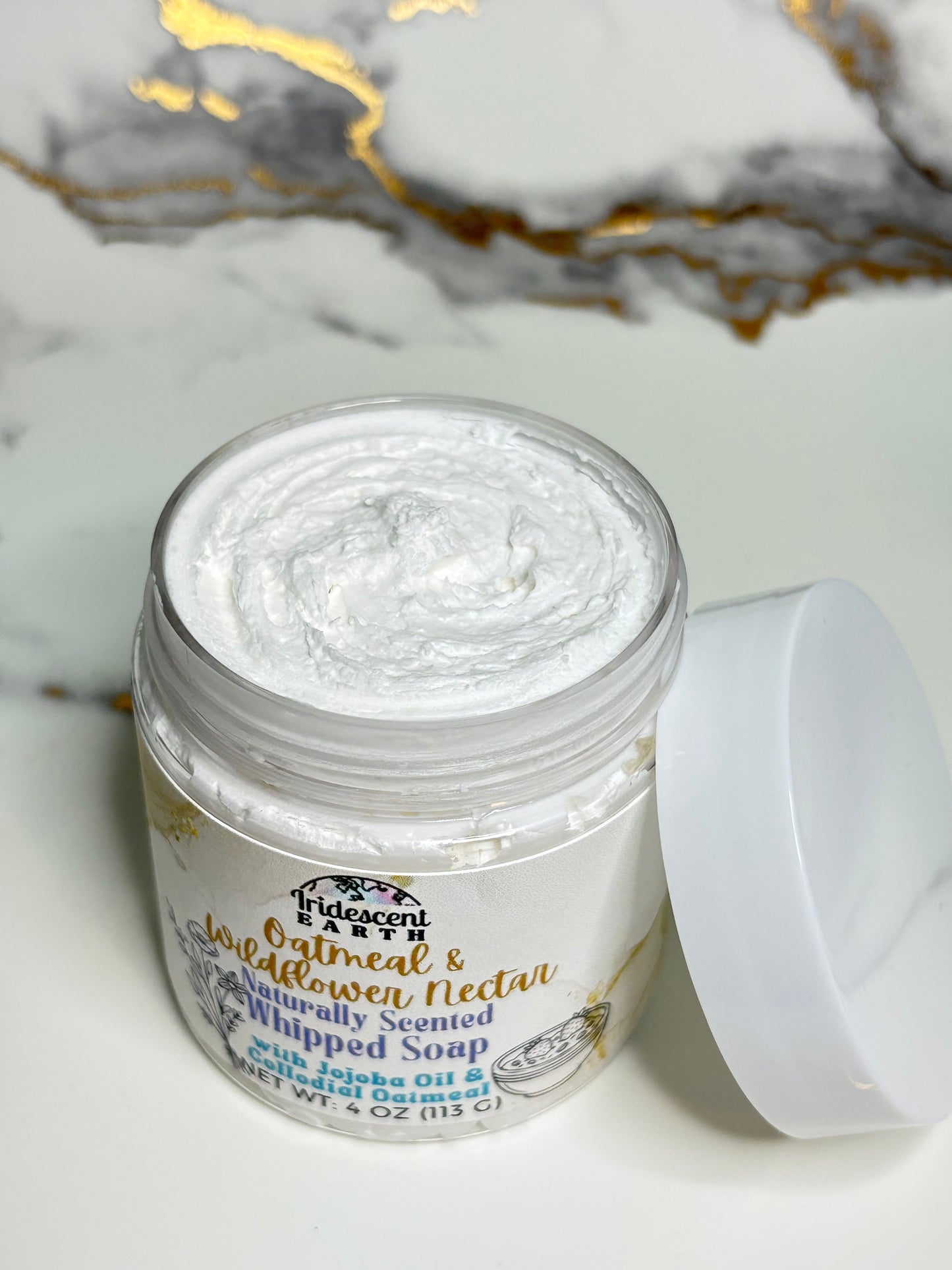 Jar of white cream with a marble background