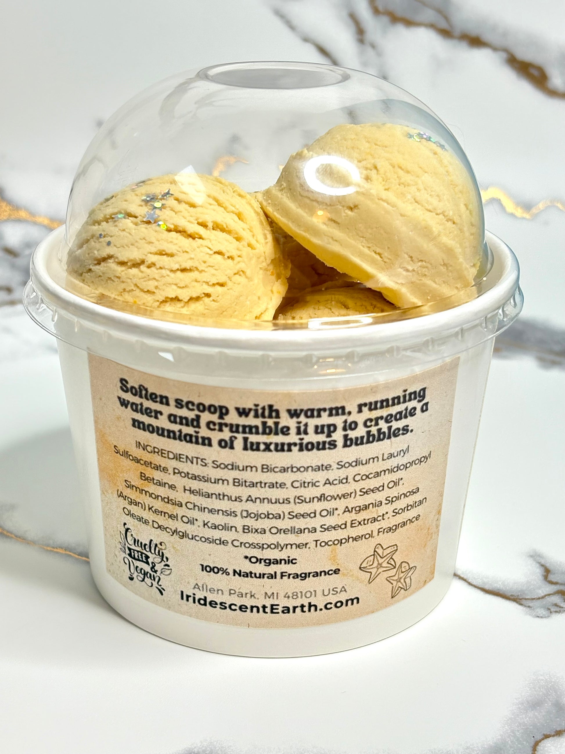 Back of bubble bath scoops container. Displays a label with the ingredients.